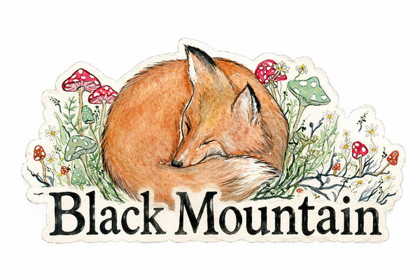 Watercolor sleeping fox sticker with mushrooms and wildflowers reading Black Mountain