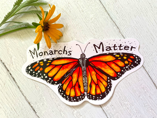Monarch butterfly watercolor sticker shown on a water bottle
